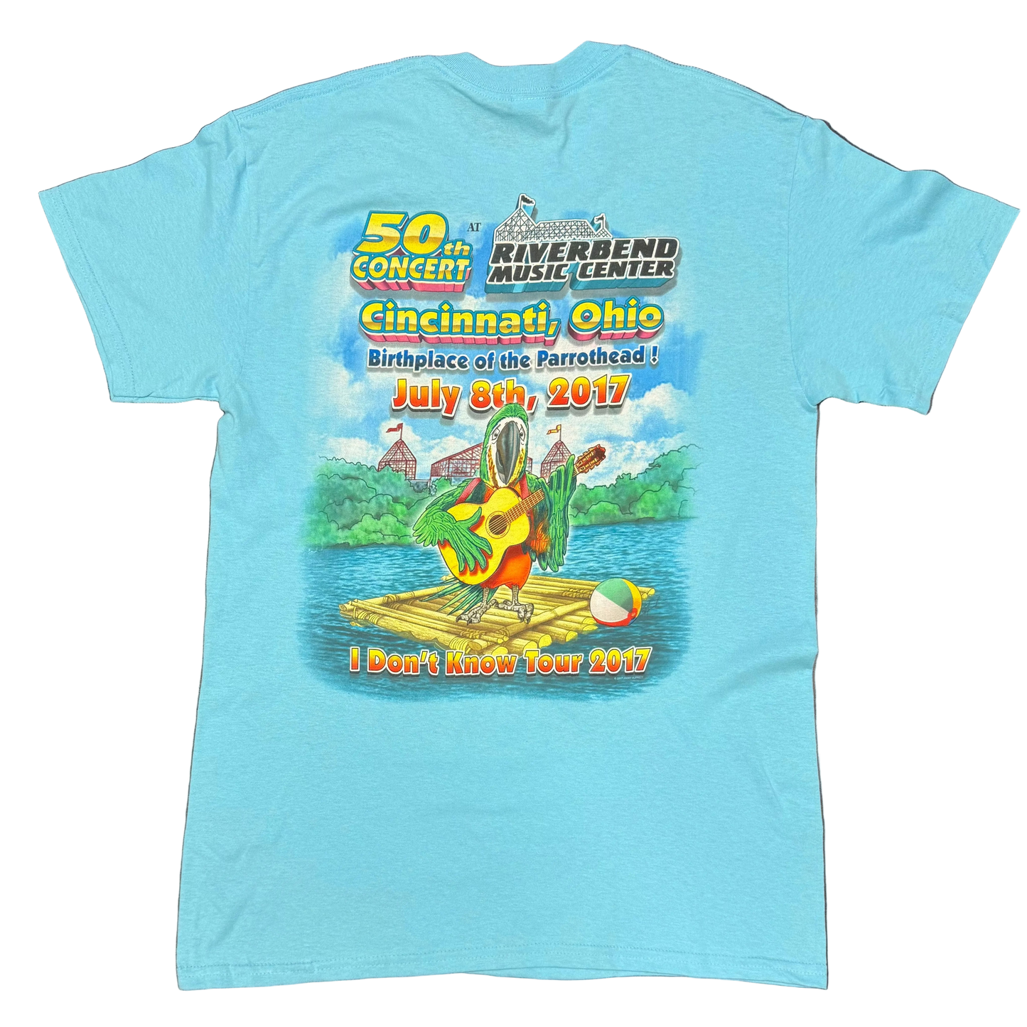 Back of a light blue aqua short sleeve Jimmy Buffett tee commemorating the 50th concert at Riverbend Music Center in Cincinnati, Ohio on July 8, 2017. The design features “Birthplace of the Parrothead!” lettering above a colorful parrot playing guitar on a raft, with “I Don’t Know Tour 2017” printed at the bottom.