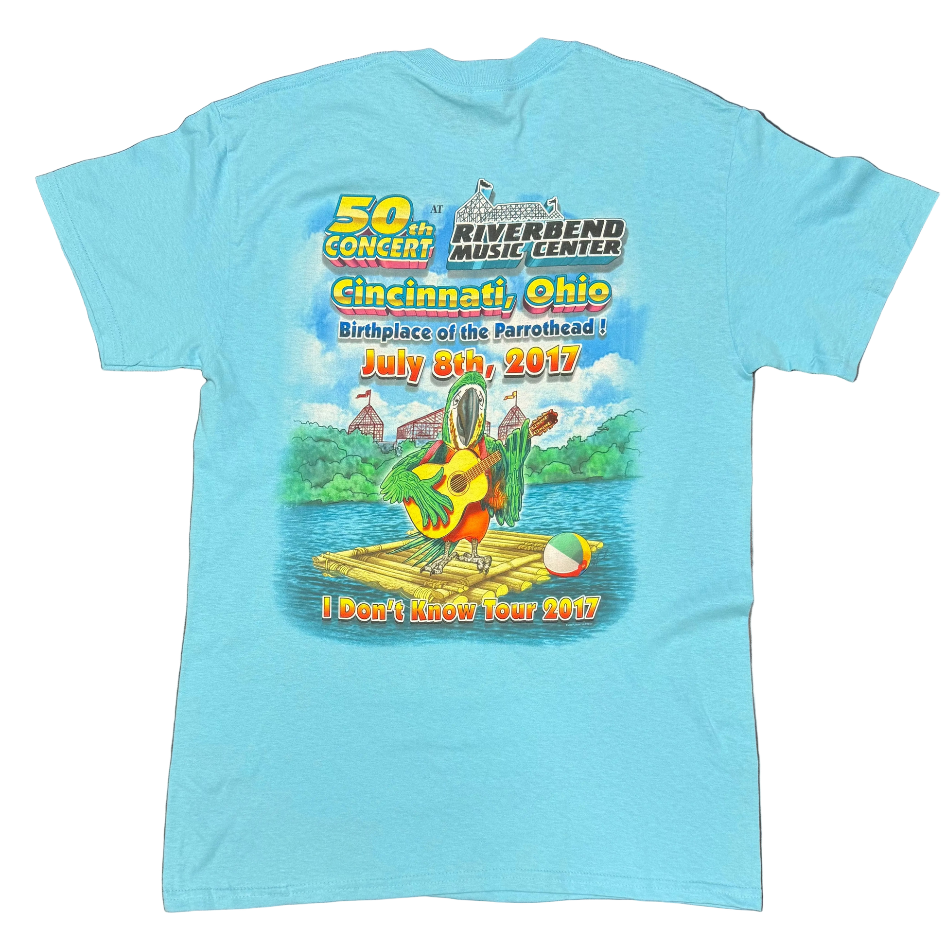 Back of a light blue aqua short sleeve Jimmy Buffett tee commemorating the 50th concert at Riverbend Music Center in Cincinnati, Ohio on July 8, 2017. The design features “Birthplace of the Parrothead!” lettering above a colorful parrot playing guitar on a raft, with “I Don’t Know Tour 2017” printed at the bottom.
