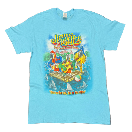 Light blue aqua short sleeve Jimmy Buffett tee featuring Jimmy Buffett and the Coral Reefer Band lettering above three colorful parrots playing drums and guitar on a raft. Shark fins circle the raft in the water, with “fins to the left, fins to the right” printed below the artwork.