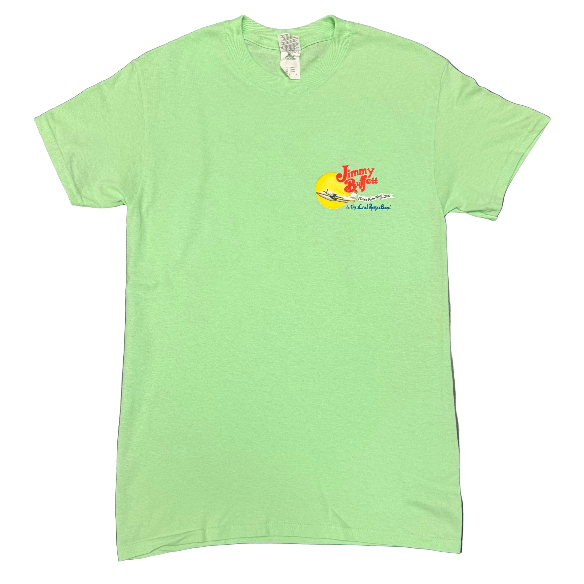 Light green short sleeve Jimmy Buffett tee featuring a small left chest graphic with red “Jimmy Buffett” lettering above a yellow sun and a seaplane. “I Don’t Know Tour 2017” appears in the center, with “and The Coral Reefer Band” below.