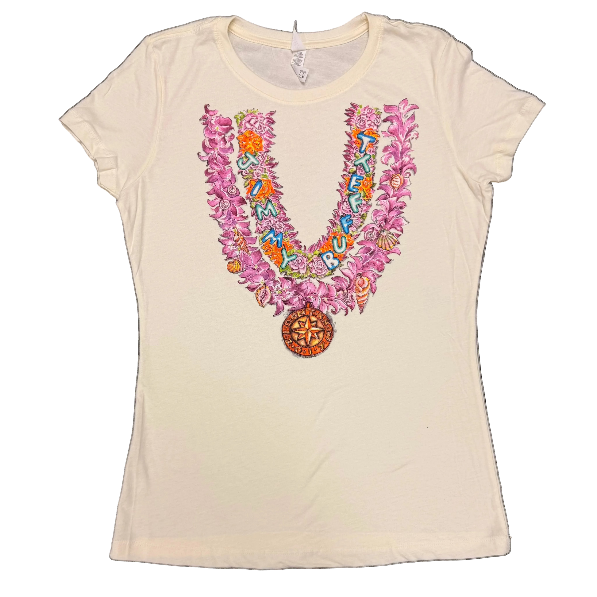 Cream women’s short sleeve Jimmy Buffett tee featuring a large V shaped tropical floral design in pink and purple with seashell accents. Colorful “Jimmy Buffett” lettering runs through the artwork, with a round nautical compass medallion at the bottom.