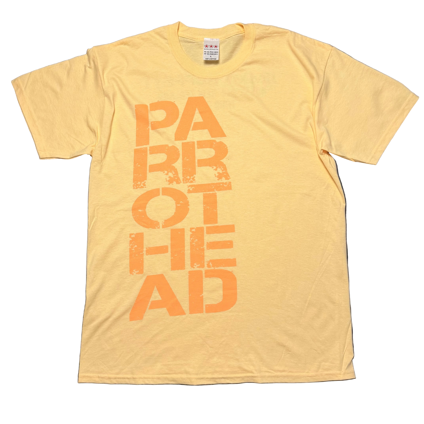 Light yellow short sleeve Jimmy Buffett tee featuring oversized distressed orange lettering spelling “Parrothead” stacked vertically down the front.