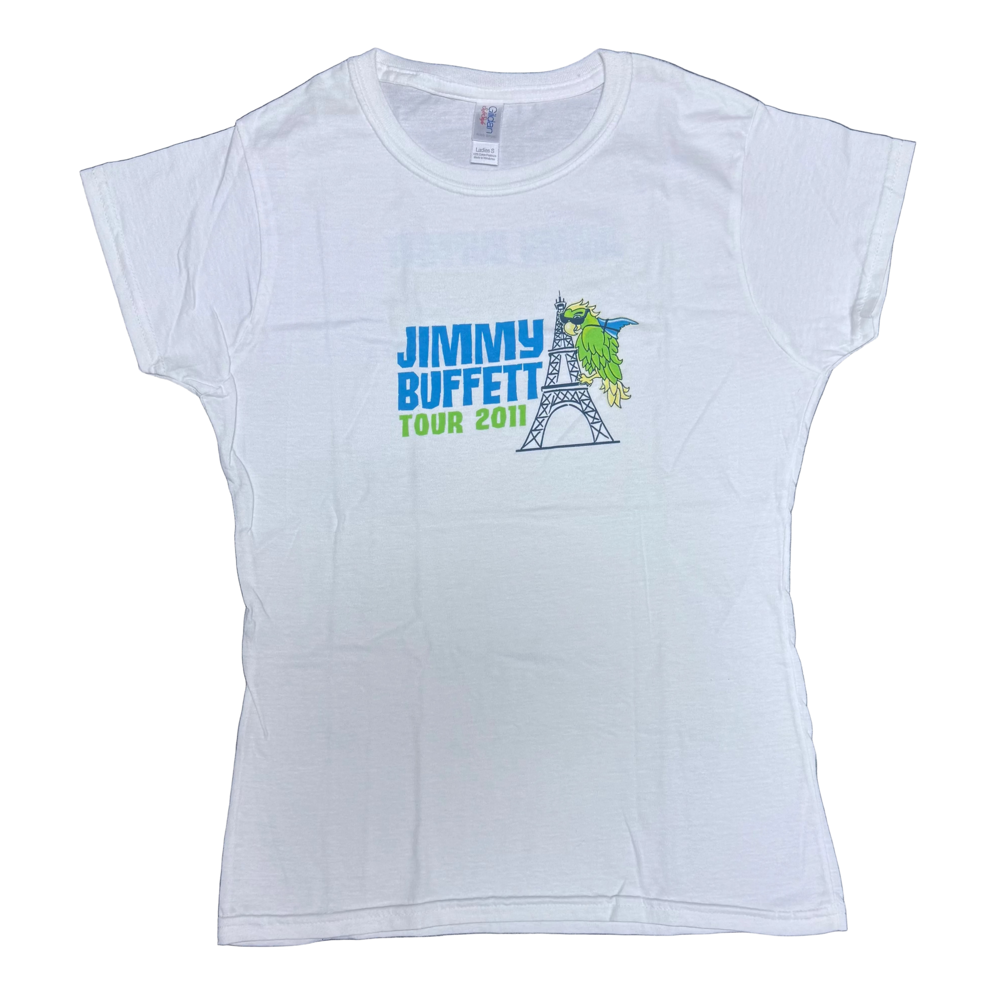 White ladies short sleeve Jimmy Buffett tee featuring bold blue “Jimmy Buffett” lettering beside a green parrot perched on the Eiffel Tower. “Tour 2011” appears below in green.