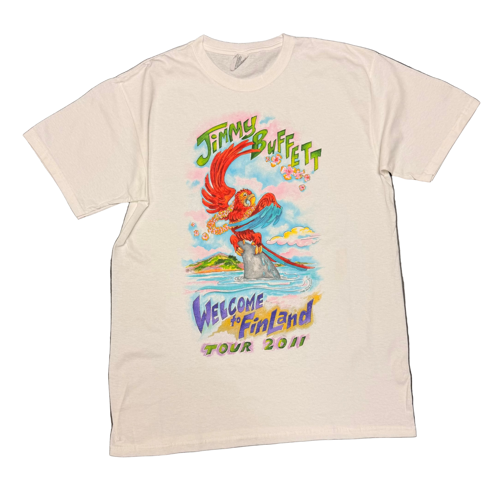 White short sleeve Jimmy Buffett tee featuring a colorful red parrot perched on a shark fin in the ocean, with a tropical island and clouds in the background. Green “Jimmy Buffett” lettering appears above the artwork, with “Welcome to Fin Land Tour 2011” printed below in purple, yellow, pink, and green.