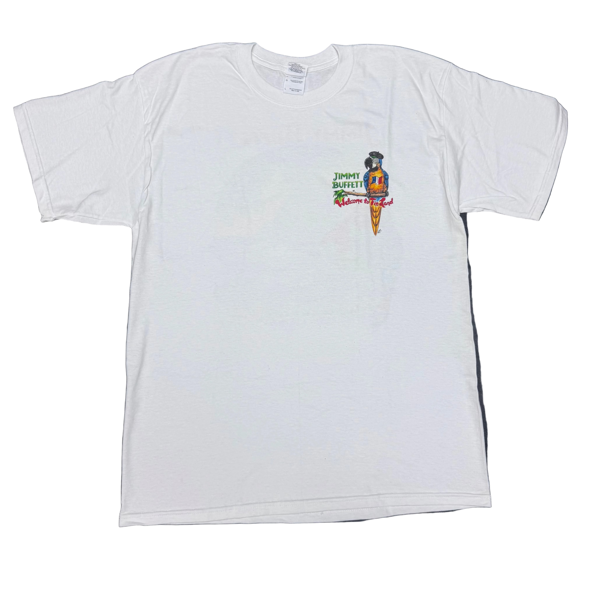 White short sleeve Jimmy Buffett tee featuring a small chest graphic of a blue and yellow macaw wearing a black beret and a French flag emblem. “Jimmy Buffett” appears beside the parrot, with colorful “Welcome to Fin Land” lettering below.